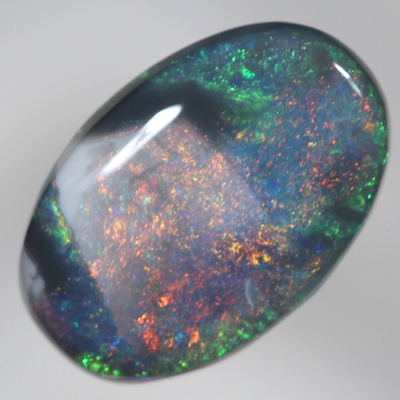 SOLID BLACK OPAL Unusual pattern, burning red bordered by black opal and sparkling green
